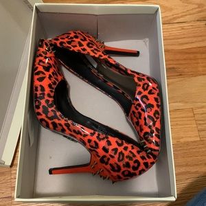 Hot orange leopard studded heels.